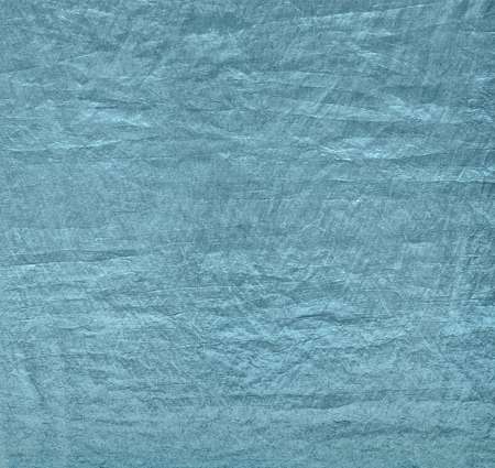Background made of silk green cloth. Crumpled texture fabricの写真素材