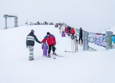 MOSCOW, RUSSIA - JANUARY 25, 2015: Ski club Leonid Tyagachev-oldest ski resort in Moscow region and training base for Russian national teams.Child's instructor shakes hands with manのeditorial素材