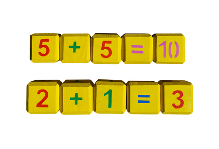Cubes with numbers and arithmetic signs isolated on white background