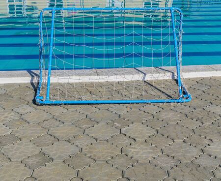 Thermal  swimming pool and gate for water polo game. Sunny day