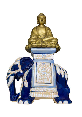 Golden Buddha sits in lotus posture on blue ceramic elephant.  Isolated on white backgroundのeditorial素材