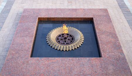 Burning eternal flame at mass tomb of soldiers. Memorial in honor of victory in second world warの写真素材