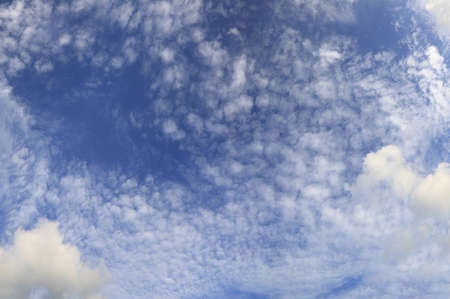 Blue sky and lots small clouds, may be used as backgroundの写真素材