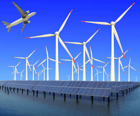 Aircraft is flying in eco power of wind turbines and solar panel plant at concept の写真素材