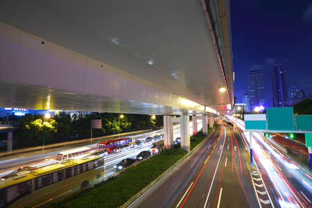 Long exposure photo High-speed urban viaduct construction background at night