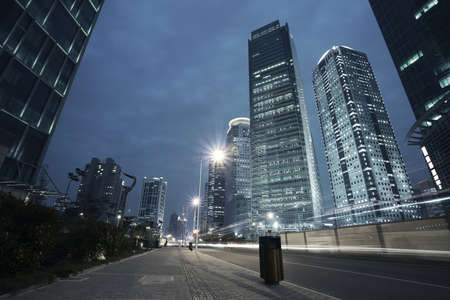Bottom angle shooting highway car light trails of modern urban buildings 
の写真素材
