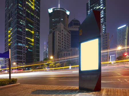 Road car light trails through at modern city advertising light boxes 

の写真素材