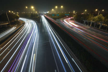 View dusk urban rainbow light night traffic on the highway skyline 
の写真素材