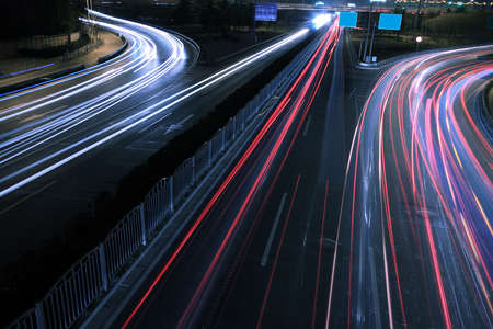 View dusk urban rainbow light  night traffic on the highway skylineの写真素材