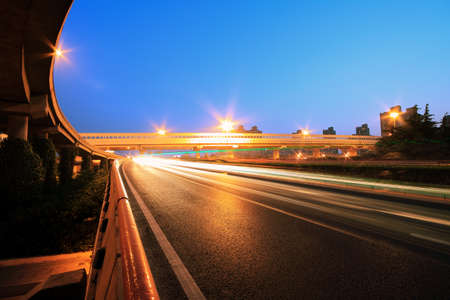 Urban ring highway viaduct long exposure photo light trails night landscape