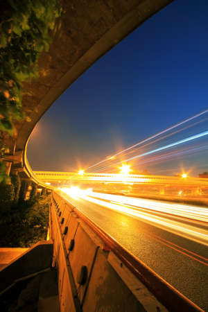 Long exposure shot of Highway viaduct vehicle night sceneの写真素材