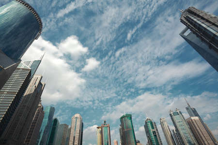 Looking up at the modern urban office buildings backgrounds at Shanghaiの写真素材