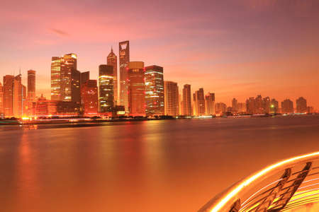 Photo of modern buildings by Huangpu river at dawn Pudong Lujiazui Skyline Shanghai, China