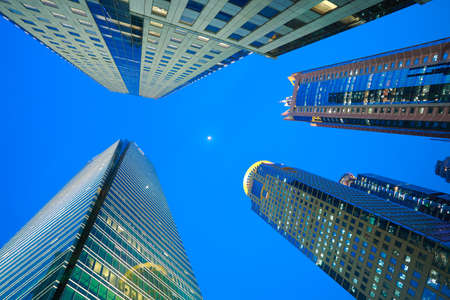 Looking up at Shanghai modern city buildings backgrounds of night sceneの写真素材