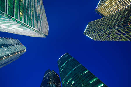 Looking up at Shanghai modern city buildings backgrounds of night sceneの写真素材