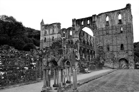 A view of the extensive ruins of the medieval Rievaulx abbey in North Yorkshireの写真素材