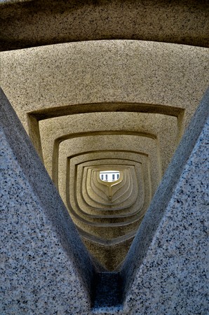 A view of a stone sculpture looking toward the Tay bridge in the harbour at Dundeeの写真素材