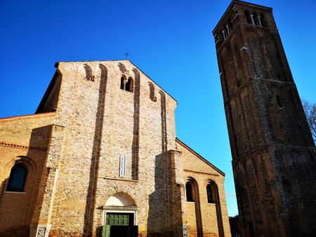 A view of a tall church tower on the Venetian island of Muranoの写真素材