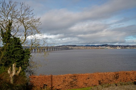 A view of the rail bridge over the river Tay from Wormit to the city of Dundeeの写真素材