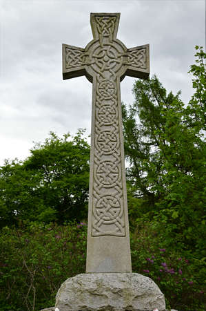 A view of a decorative Cross style war memorial in the Royal Deeside village of Braemar.のeditorial素材