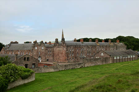 A view of the barracks buildings from the medieval old town defensive wall which surrounds the Northumberland town of Berwick Upon Tweed.の写真素材