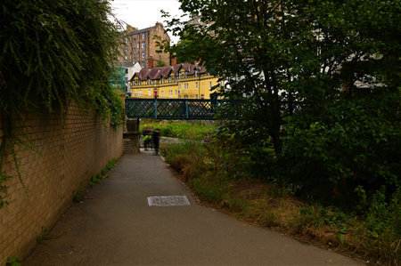 A view along the riverside walkway toward Dean village in the city of Edinburgh