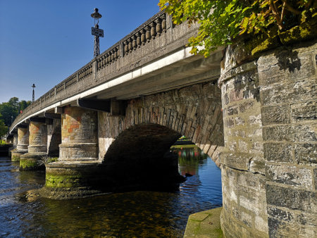 A view of the old stone Dumbarton Bridge in the west of Scotland.の写真素材