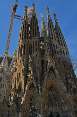 An exterior view of a stunning cathedral building still under construction in the city of Barcelona in Spain.の写真素材