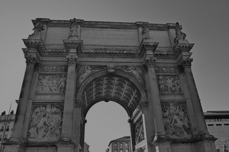 A view of the ornate stone triumphal arch in the French city of Marseille.の写真素材