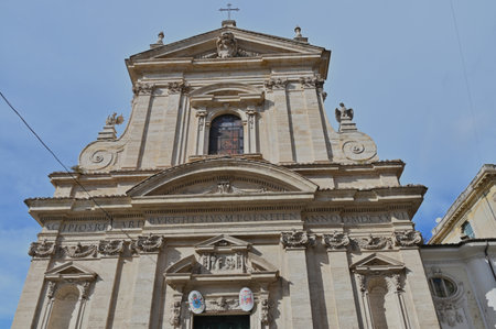 An exterior view of the architectural detail of a religious church building in the city or Rome in Italyの写真素材