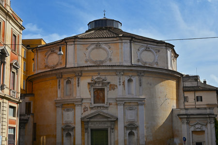 An exterior view of the architectural detail of a religious church building in the city or Rome in Italyの写真素材