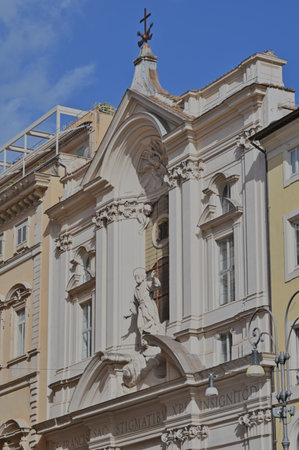 An exterior view of the architectural detail of a religious church building in the city or Rome in Italyの写真素材