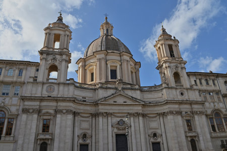 An exterior view of the architectural detail of a religious church building in the city or Rome in Italyの写真素材