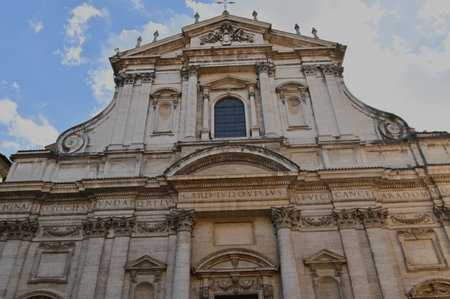 An exterior view of the architectural detail of a religious church building in the city or Rome in Italyの写真素材