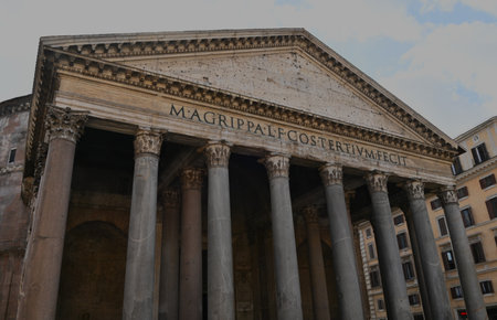 An exterior view of the architectural detail of a religious church building in the city of Rome in Italyの写真素材