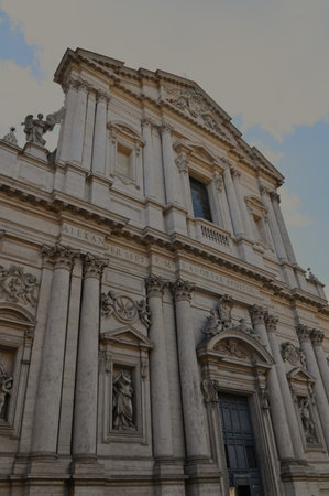An exterior view of the architectural detail of a religious church building in the city or Rome in Italyの写真素材