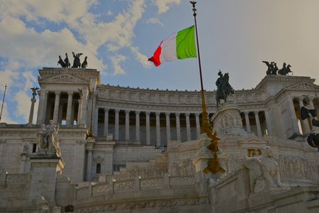 A view of the stunning facade of the neoclassical marble temple which is a monument to Victor Emmanuelle II in the city of Rome in Italy.の写真素材