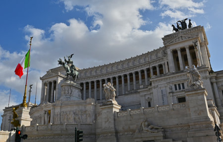 A view of the stunning facade of the neoclassical marble temple which is a monument to Victor Emmanuelle II in the city of Rome in Italy.の写真素材