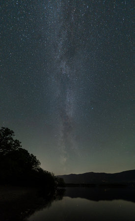 A view of the Milky way over Derwentwater in the English Lake Districtの写真素材