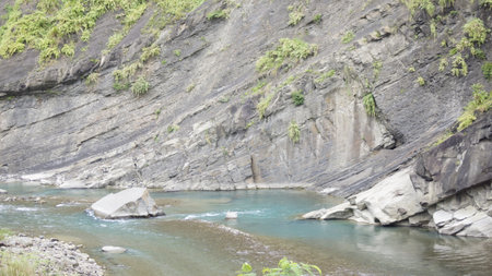 landscape of a river flowing through a gorge on a sunny dayの写真素材