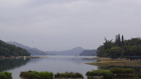 Landscape view of lake and mountain in the morning at hong kongの写真素材