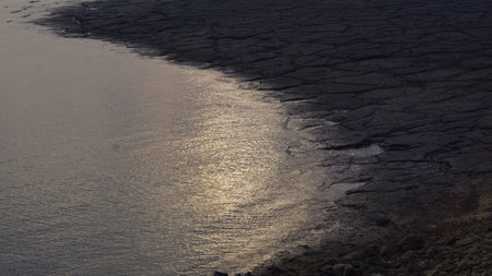 Sunset over the Dead Sea, Israel. The sun is reflected in the water.の写真素材