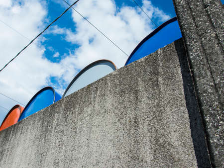 colored metal barrel, oil containers Placed outdoorの写真素材