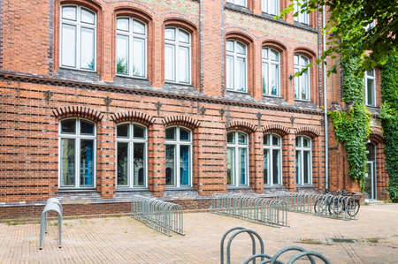 Urban bike parking placed near an ancient corner of a German cityの写真素材