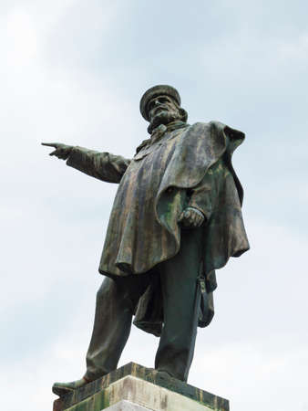 Giuseppe Garibaldi sculpture indicates a point in the right of himの写真素材