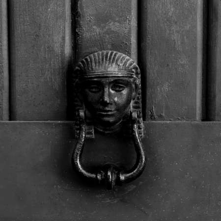 Ancient door handle with an egyptian figuresの写真素材
