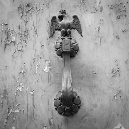 Ancient door handle with an eagle figuresの写真素材