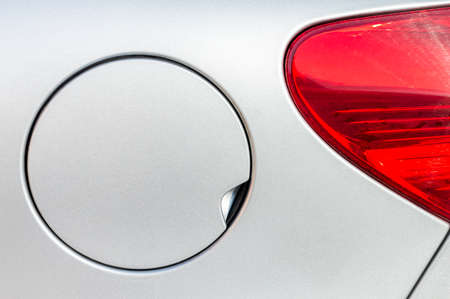 A close up of a petrol cap cover on a modern white carの写真素材