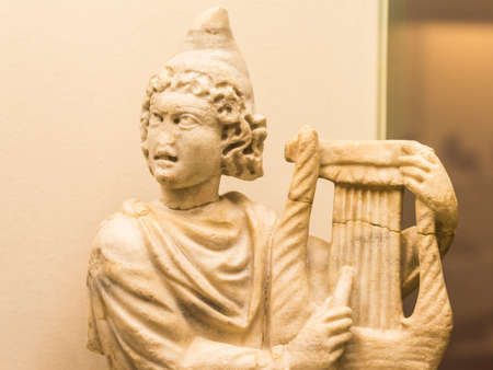 Bust detail of the ancient chinese sculpture of stone who plays lyreのeditorial素材