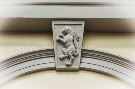 Stone gate with a lion Symbol, Italy, ancient building.